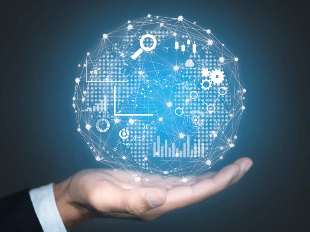 Hand holding a digital globe with interconnected data icons, charts, and analytics symbols representing global data analysis and technology.