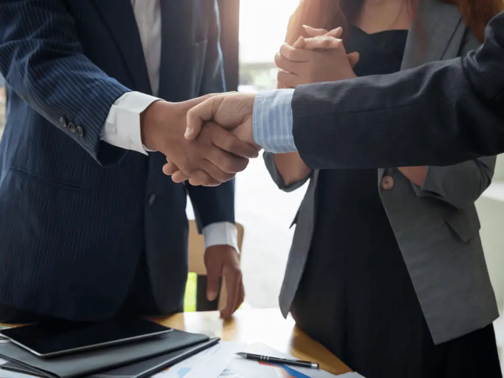 Two business persons shaking hands